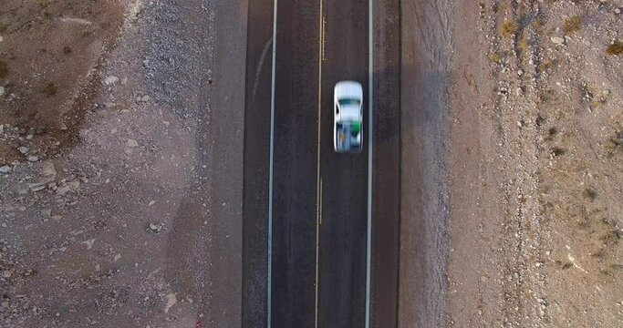 Aerial Top Lockdown Shot Of Cars Moving On Road In Desert - Las Vegas, Nevada