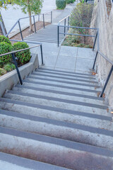 High angle view of an outdoor concrete stairs with landing in the middle at San Francisco, CA