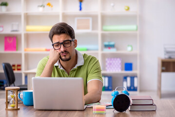 Young male designer working in the office