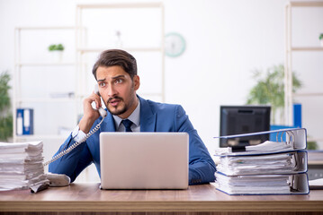 Fototapeta premium Young businessman employee working in the office