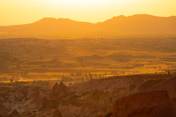 Fototapeta na wymiar Cappadocia view at sunset. Sunset at kizilcukur Valley in ortahisar Nevsehir