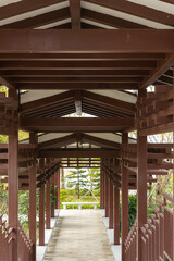 pathway with wooden roofs vertical composition