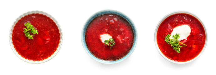 Bowls of tasty Ukrainian borscht with sour cream on white background