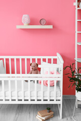 Fototapeta na wymiar Interior of beautiful children's room with stylish decor and crib
