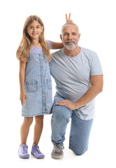 Funny little girl with her grandfather on white background