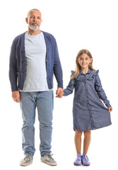 Senior man with his little granddaughter holding hands on white background