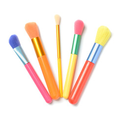 Set of colorful makeup brushes on white background