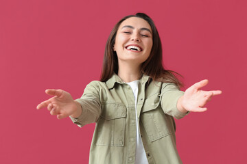 Beautiful smiling young woman  on color background