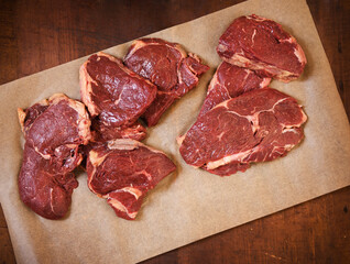Grass Fed Sirloin Steaks on Parchment Paper.