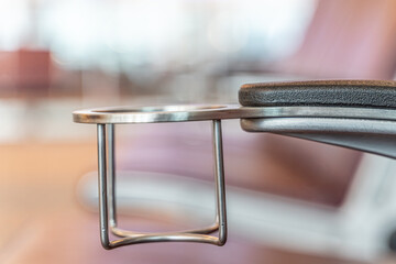 Cupholder in airport terminal to hold drinks