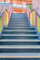Concrete outdoor stairs with colorful railings near the Fisherman's Wharf in San Francisco, CA