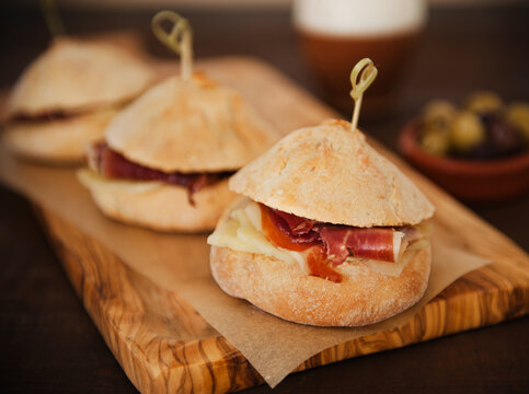 Three Bocadillos on a Cutting Board