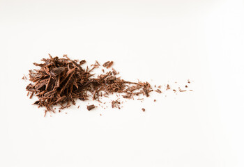 Pile of chocolate shavings on white
