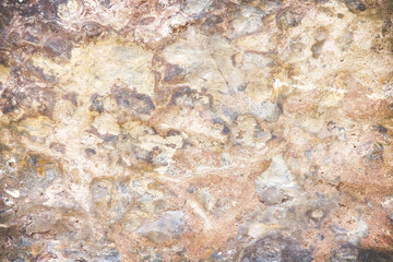 Old rocks surface with brown grunge patterns for natural detail background