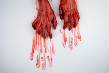 Female hands in blood on a white background. 