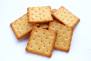 Dry cracker cookies on white background.