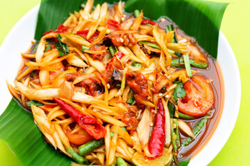 Spicy papaya salad with pickled shells