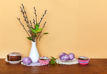 Beautiful Easter still life with a spring bouquet of willow branches, traditional painted Easter...