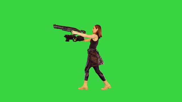 Game-character girl walks with machine guns, shooting with both hands on a Green Screen, Chroma Key.
