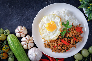 Thai food, stir-fried basil with pork and fried egg Popular food of Thailand, original Thai food concept.