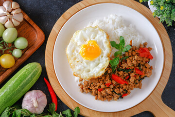 Thai food, stir-fried basil with pork and fried egg Popular food of Thailand, original Thai food concept.