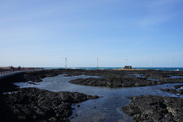 wonderful seascape with distant turbine on the sea