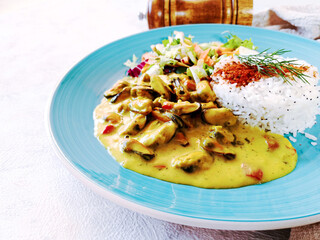 Mussels with curry sauce Rice and salad