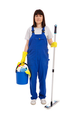 professional cleaning service concept - portrait of woman cleaner in blue uniform posing with mop and cleaning equipment isolated on white background