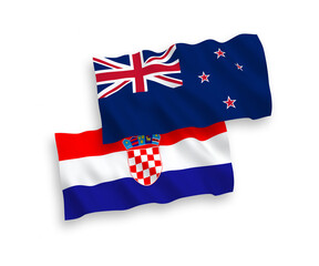 National vector fabric wave flags of New Zealand and Croatia isolated on white background. 1 to 2 proportion.