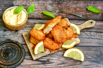   Allasca Pollock Fish  Bites in a crispy Tempura  Batter.Fish and chips .Close up of   crispy...