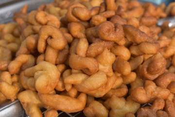 Patongko or deep-fried dough sticks, traditional morning snack or breakfast of Thai and Chinese, close up Patongko or deep-fried dough sticks.