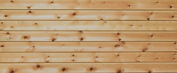 The texture of the surface of a brown board with natural patterns.Natural wooden background of panoramic view
