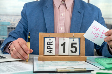 Businessman making calculation financial annual report and after fill 1040 tax form