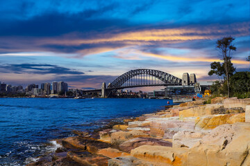 Sydney Harbour Australia with nice colours in the sky. Nice blue water of the Harbour, high rise offices and residential buildings of the City in the background, NSW Australia