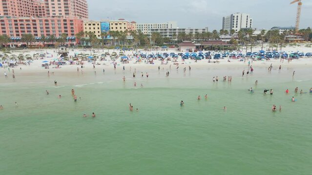 Crowded beach in Clearwater Florida, beautiful white sand, spring break, aerial