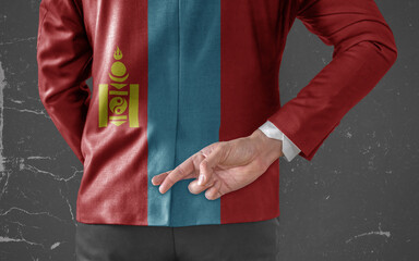 Businessman Jacket with Flag of Mongolia with his fingers crossed behind his back