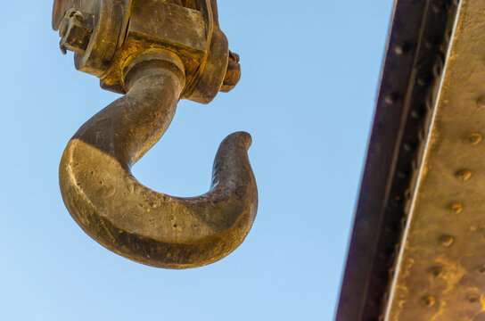 A large cast-iron hook hangs from the top.
