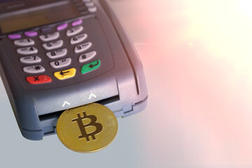 Bitcoin btc crypto currency as decentralized finance payment on credit card machine, calculator, mobile phone. Concept of contactless payment