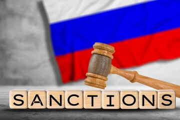 Classic judge's gavel with wooden cubes for the text with Russian flag, Concept on the of sanctions in Russia