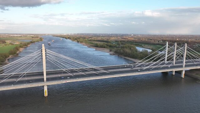Road surface and traffic on Tacitusbrug bij Ewijk modern suspension bridge crossing the river Waal near Nijmegen, the Netherlands Holland Europe. Valburg and Ewijk.