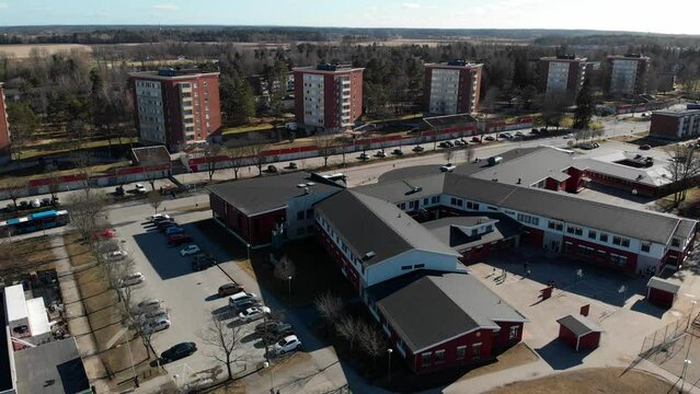 School in Kronogarden suburb in Trollhattan, Sweden, residential area aerial establishing shot