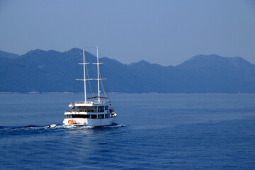 view over the sea and a boat taken from the ferry to the island Mljet, croatia