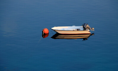 sloop reflecting in the blue water,  N.P. Mljet, island Mljet, croatia