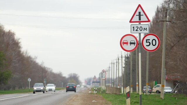 Speed limit. 50 kmph. 50 km per hour. No overtaking. Danger part of the road. European road sign. Crosroad sign. Traffic limit. Overtaking is prohibited Road warning sign overtaking is forbidden and