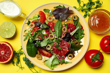 Concept of tasty food, salad with red orange, top view