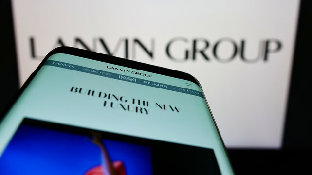 Stuttgart, Germany - 03-29-2022: Mobile phone with website of Chinese fashion company Lanvin Group on screen in front of business logo. Focus on top-left of phone display.