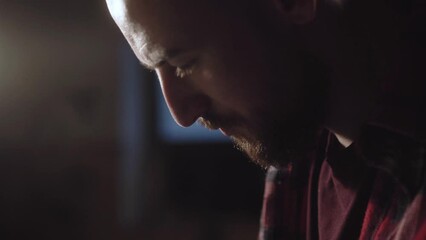 Close-up hands carve with the knife the pattern of leather and remove excess part. Tanner, tailor master works behind the workbench and creating leather goods. Handmade.