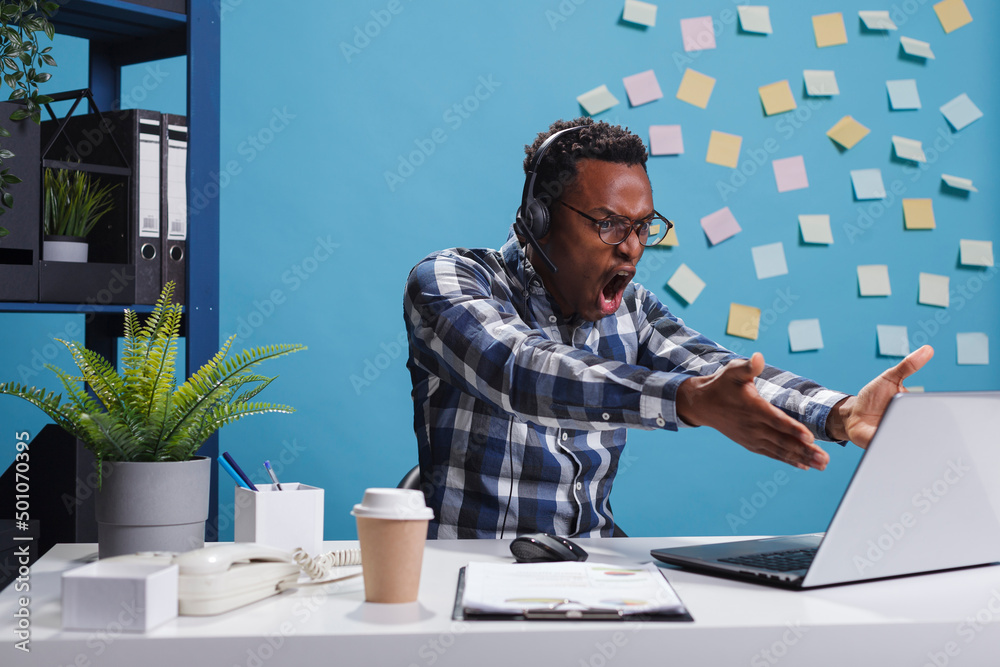 Wall mural mad angry customer support call center operator shouting with rage while in call with client. furiou
