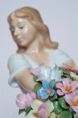 beautiful porcelain doll with flowers