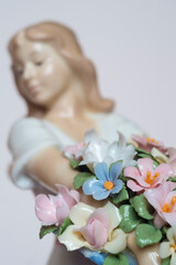 Naklejka premium beautiful porcelain doll with flowers